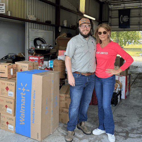 man and woman with hurricane supplies