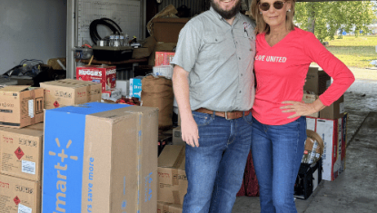 man and woman with hurricane supplies