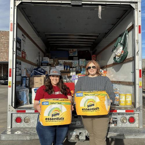 two women with hurricane supplies